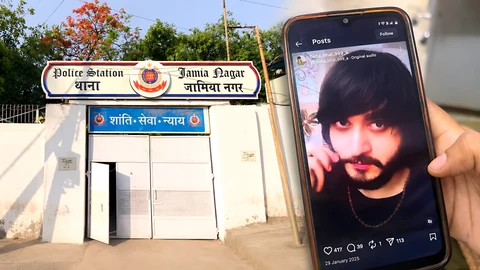 Jamia Nagar police station entrance beside a phone displaying a man's portrait.
